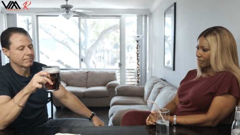 Couple enjoying drinks at home