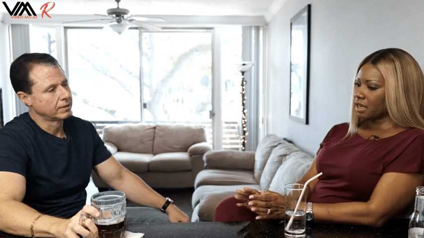 Two people talking indoors