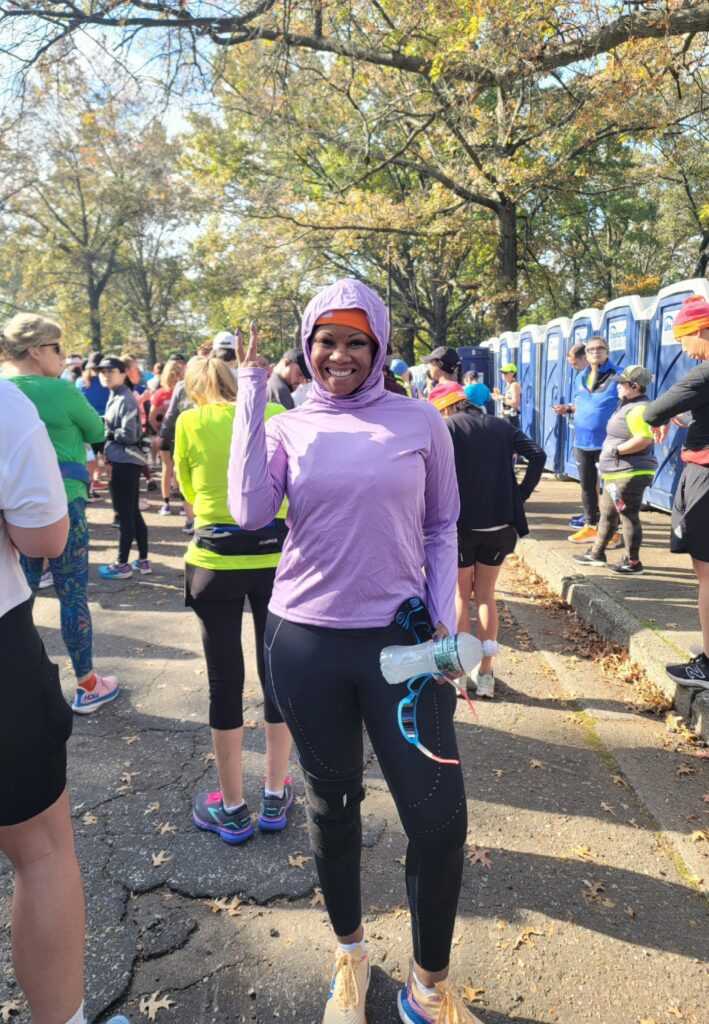Runner makes peace sign